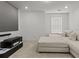 Modern theater room featuring a projector screen, comfortable sectional, and entertainment center at 277 Fiddleback Dr, Summerville, SC 29486
