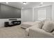 Inviting theater room with plush seating, a projector screen, and modern AV setup at 277 Fiddleback Dr, Summerville, SC 29486