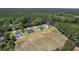 Several houses with long driveways in a wooded and grassy neighborhood offer modern comfort in a natural setting at 306 Mizell Rd, Dorchester, SC 29437