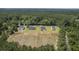 An aerial view of four newly built homes in a wooded setting at 306 Mizell Rd, Dorchester, SC 29437