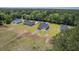 An aerial shot showing four newly built homes, with some lawns partially seeded at 306 Mizell Rd, Dorchester, SC 29437