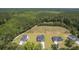 New homes boast dark roofs, paved driveways and a large lot, all set against a backdrop of dense forest at 306 Mizell Rd, Dorchester, SC 29437