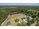 New homes with paved driveways sit on grassy lots surrounded by woods, offering a blend of comfort and nature at 306 Mizell Rd, Dorchester, SC 29437