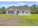 Backyard with a lawn and gray house siding at 306 Mizell Rd, Dorchester, SC 29437