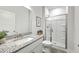 Bathroom with granite countertop sink and walk-in shower with glass door at 306 Mizell Rd, Dorchester, SC 29437