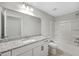 Bathroom with granite countertops, white cabinets, and a shower-tub combo at 306 Mizell Rd, Dorchester, SC 29437