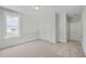 Carpeted bedroom with closet and windows with view at 306 Mizell Rd, Dorchester, SC 29437