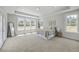 Bright bedroom with multiple windows, carpet, and neutral décor at 306 Mizell Rd, Dorchester, SC 29437