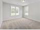 Carpeted bedroom featuring neutral walls and large windows at 306 Mizell Rd, Dorchester, SC 29437