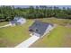 New construction home features a covered front porch, attached garage and pristine lawn, perfect for suburban living at 306 Mizell Rd, Dorchester, SC 29437