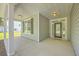 Covered front porch with recessed lighting offers a welcoming entrance to the home and a view of the front yard at 306 Mizell Rd, Dorchester, SC 29437