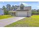 Lovely home featuring an attached two car garage and a spacious driveway in a well-kept neighborhood at 306 Mizell Rd, Dorchester, SC 29437