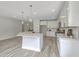 Kitchen with white cabinets, stone countertops, stainless steel appliances, and island at 306 Mizell Rd, Dorchester, SC 29437