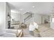 Bright living room with fireplace, wood floors, staircase, and modern neutral decor at 306 Mizell Rd, Dorchester, SC 29437