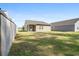 Expansive backyard featuring a well-maintained lawn, wooden fence, and back exterior of the home with siding at 309 Sedona Dr, Summerville, SC 29486