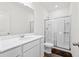 A bathroom with a large mirror, a sink with a white vanity, a toilet, and a glass-enclosed shower at 309 Sedona Dr, Summerville, SC 29486