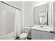 Bright bathroom features a shower-tub combo, a mirror, and a white vanity with storage at 309 Sedona Dr, Summerville, SC 29486