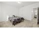 A well-lit bedroom features neutral walls and carpet and a bed with a patterned comforter at 309 Sedona Dr, Summerville, SC 29486