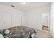 A bedroom featuring neutral walls, carpet and entry to the bathroom, with a bed and patterned comforter at 309 Sedona Dr, Summerville, SC 29486