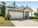 Beautiful home featuring a pristine lawn, a two-car garage, and lovely curb appeal in a quiet neighborhood at 309 Sedona Dr, Summerville, SC 29486