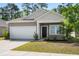 Attractive home exterior with a two-car garage, neat landscaping, and a welcoming front entrance at 309 Sedona Dr, Summerville, SC 29486