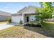 Inviting single-story home with a well-maintained lawn, tidy shrubs, and a two-car garage, ready for move-in at 309 Sedona Dr, Summerville, SC 29486