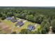 Aerial shot of new construction homes featuring well manicured lawns and wooded landscape at 310 Mizell Rd, Dorchester, SC 29437