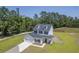 Aerial view showcasing home, driveway, and landscaping at 310 Mizell Rd, Dorchester, SC 29437