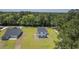 Aerial view highlighting the new homes, expansive lawns, and proximity to lush woodlands at 310 Mizell Rd, Dorchester, SC 29437