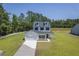 Aerial view of home with well-manicured lawn and driveway at 310 Mizell Rd, Dorchester, SC 29437