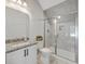 Bathroom with granite countertops, modern vanity, and glass-enclosed tiled shower at 310 Mizell Rd, Dorchester, SC 29437