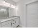 Bright bathroom with double sink vanity, granite countertop, and a tiled walk-in shower at 310 Mizell Rd, Dorchester, SC 29437