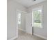 Well lit bedroom with two windows, neutral walls, and views to the backyard at 310 Mizell Rd, Dorchester, SC 29437