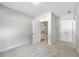Light-filled bedroom with a view into the attached bathroom and a closet with paneled doors at 310 Mizell Rd, Dorchester, SC 29437