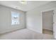 Cozy bedroom with neutral walls, carpet flooring, and an en suite bathroom for added privacy at 310 Mizell Rd, Dorchester, SC 29437