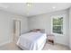 Neutral-toned bedroom featuring a comfortable bed, bedside table, and a sunlit window for a calming atmosphere at 310 Mizell Rd, Dorchester, SC 29437
