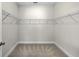 Walk-in closet with a carpeted floor and multiple wire shelves for storage at 310 Mizell Rd, Dorchester, SC 29437