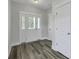 Bright entryway with wood-look flooring, offering a stylish introduction to the home at 310 Mizell Rd, Dorchester, SC 29437