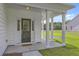 Inviting front porch with white columns, providing a welcoming entrance to the home at 310 Mizell Rd, Dorchester, SC 29437