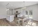 Bright kitchen featuring white cabinets, stainless steel appliances, an island and an adjacent dining area at 310 Mizell Rd, Dorchester, SC 29437