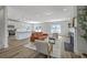 Open-concept living room featuring a fireplace, natural light, and modern furnishings at 310 Mizell Rd, Dorchester, SC 29437