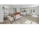 Open concept living space with hardwood floors, an orange sofa, and lots of natural light at 310 Mizell Rd, Dorchester, SC 29437