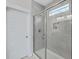 Modern tiled walk-in shower with a glass door and shower niche at 310 Mizell Rd, Dorchester, SC 29437