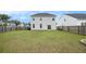 Spacious backyard with a well-maintained lawn, fenced perimeter, and a two-story home at 313 Catawba Branch Way, Moncks Corner, SC 29461