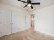 Bedroom with light carpet, a closet with double doors, and a ceiling fan at 313 Catawba Branch Way, Moncks Corner, SC 29461