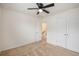 Bedroom with light carpet, white walls, ceiling fan, and a double door closet at 313 Catawba Branch Way, Moncks Corner, SC 29461