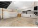 Spacious two-car garage with a high ceiling, lighting, and extra storage space at 313 Catawba Branch Way, Moncks Corner, SC 29461
