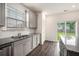 Bright kitchen featuring granite countertops, stainless steel appliances, subway tile backsplash, and wood floors at 313 Catawba Branch Way, Moncks Corner, SC 29461