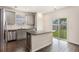 Modern kitchen featuring stainless steel appliances, gray cabinets, and a granite island counter at 313 Catawba Branch Way, Moncks Corner, SC 29461