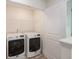 Convenient laundry room with a new white washer and dryer and wire shelving at 313 Catawba Branch Way, Moncks Corner, SC 29461